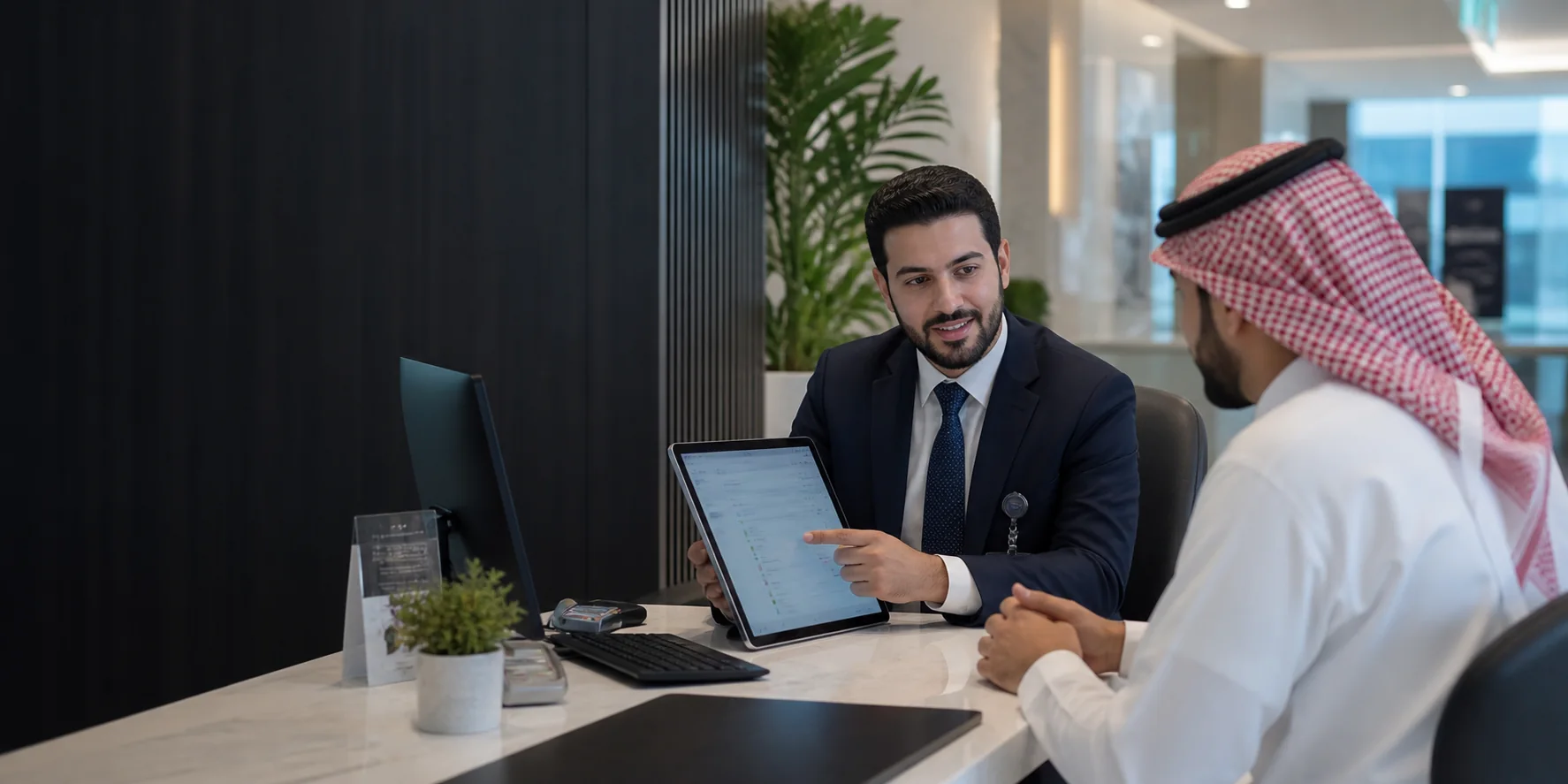 A hospital finance professional reviewing billing and insurance information with a patient.