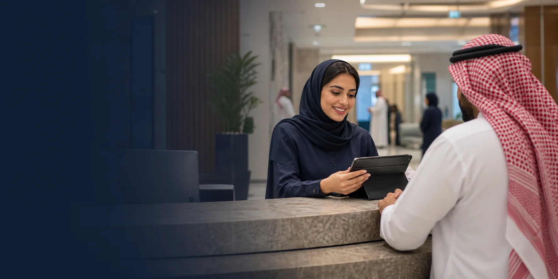 A hospital receptionist helping a patient with an outpatient appointment and check-in.